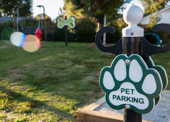 a pet parking sign on a pole in a park at Echo at Lake Norman, Mooresville North Carolina