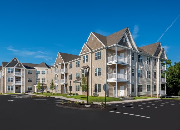 a row of apartment buildings on a city street at Eden & Main 55+ Apartments, Southington ,Connecticut, 06489