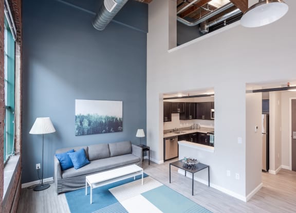 a living room with a couch and a table at Cherry Street Lofts, Bridgeport, Connecticut