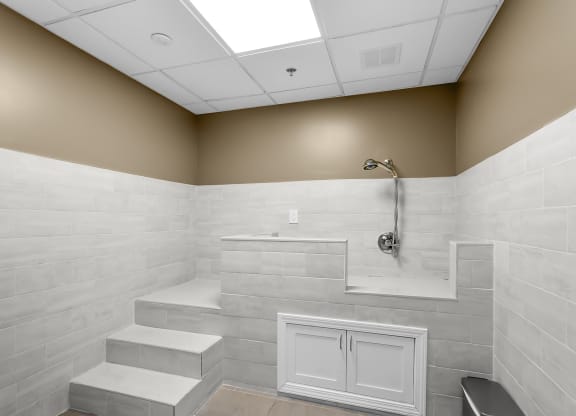 a large white bathroom with a shower and a sink at 1188 Lofts, Bridgeport, 06604