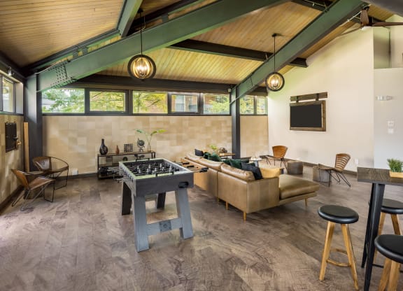 a game room with a foosball table and a couch at COVE West Hartford, West Hartford, 06119