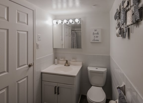 a small bathroom with a toilet and a sink at Glen Hollow, Croydon