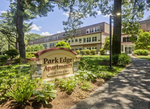 a park edge apartments sign in front of a building at Park Edge, Springfield