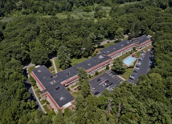 an aerial view of a building surrounded by trees at Park Edge, Massachusetts, 13502