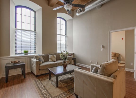 a living room with couches and a coffee table at Ponemah Mills in Taftville, CT, 06380