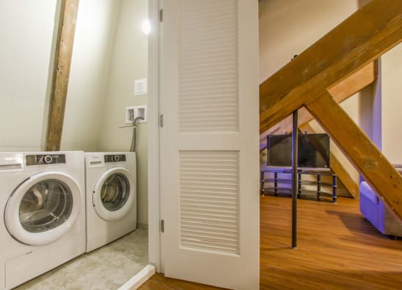a laundry room with a washing machine and a dryer at Ponemah Mills in Taftville, CT, 06380