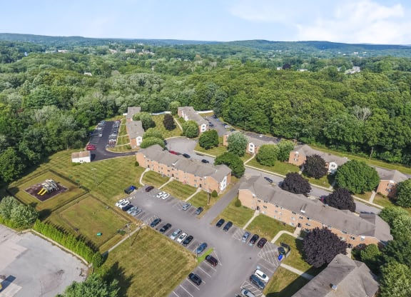 an aerial view of a neighborhood with cars parked in a parking lot at Rose Hill Estates, Norwich, Connecticut