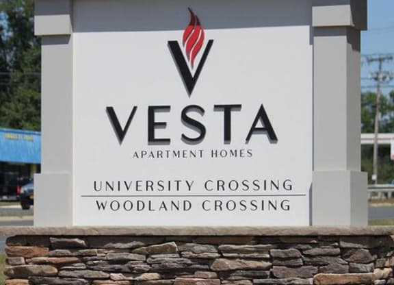 a sign for a vesa apartment homes