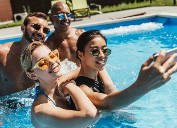 Friends in a pool taking selfie