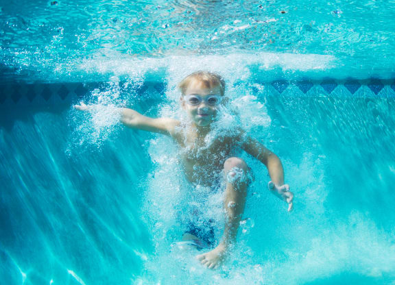 little boy swimming