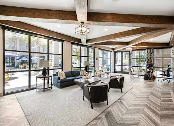 A large, open living room with a long couch and a coffee table.