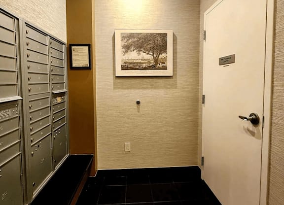 A hallway with a white door and a brown wall.