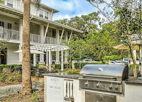 A grill with a sign that says