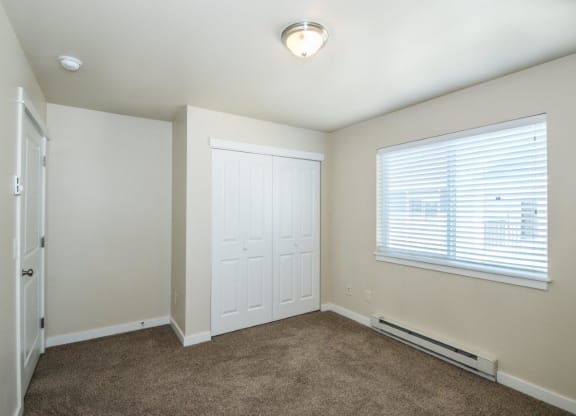 a room with carpet and a window and a door at Madison Park, Bozeman, MT, 59718