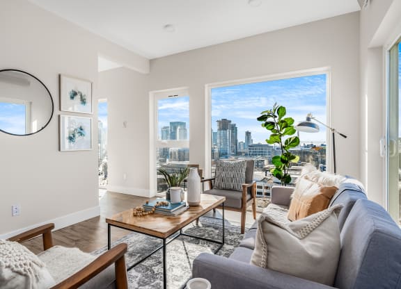an open living room with a view of the city  at Oslo, Seattle, WA