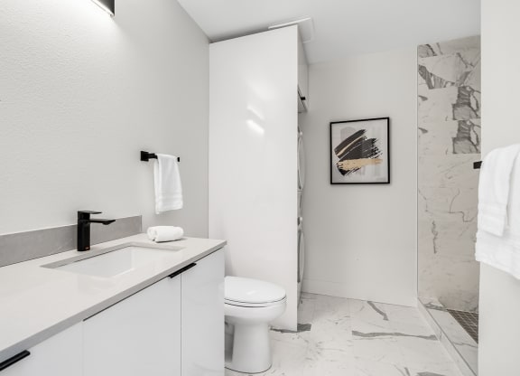 a bathroom with a sink and a toilet and a shower  at Oslo, Washington