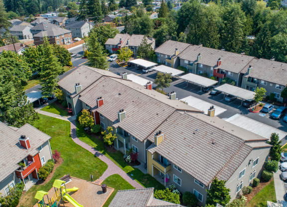an aerial view of a neighborhood of houses with roofs at Quartz Creek, Washington