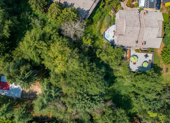 a birds eye view of a house with trees and a pool at Quartz Creek, Mountlake Terrace, WA, 98043