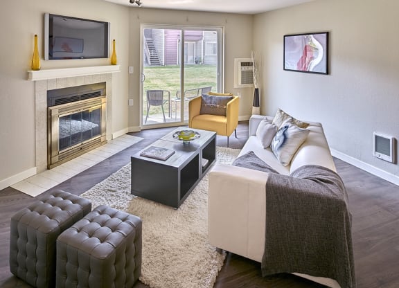 a living room with a fireplace and a couch at Quartz Creek, Mountlake Terrace, WA, 98043