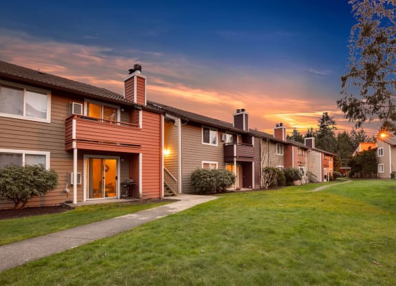 a row of houses on a city street at sunset at Quartz Creek, Washington, 98043