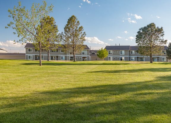 a view of an open field in front of an apartment building at Shiloh Glen, Billings, MT