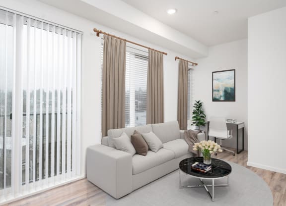 a living room with a couch and a table at The Loop at Green Lake, Washington, 98115