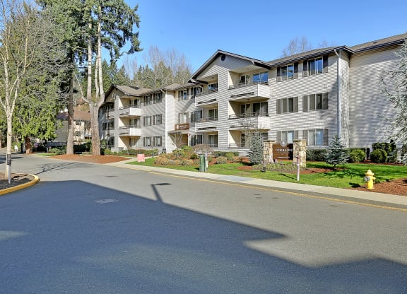 an empty street in front of an apartment building  at Townside Flats, Redmond, Washington