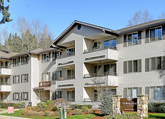 a large condo building with a street in front of it  at Townside Flats, Redmond, Washington