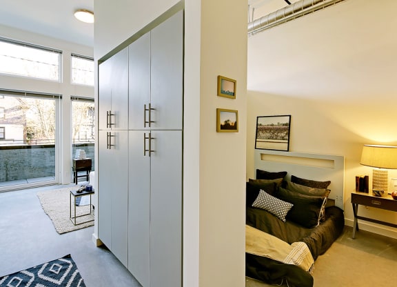 Open one-bedroom layout with storage space and an outdoor patio.at 19th & Mercer, Seattle