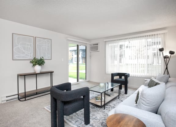 a living room with a couch and chairs and a coffee table  at Brix, Washington