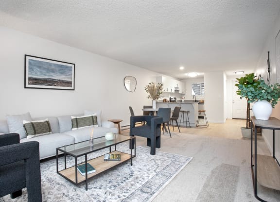 a living room with a couch and a coffee table and a dining room and kitchen  at Brix, Walla Walla, WA, 99362