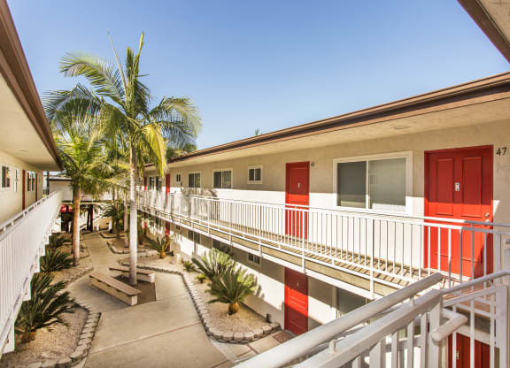 Pacific Sands walkway with tropical landscaping at Pacific Sands, San Diego, CA, 92117