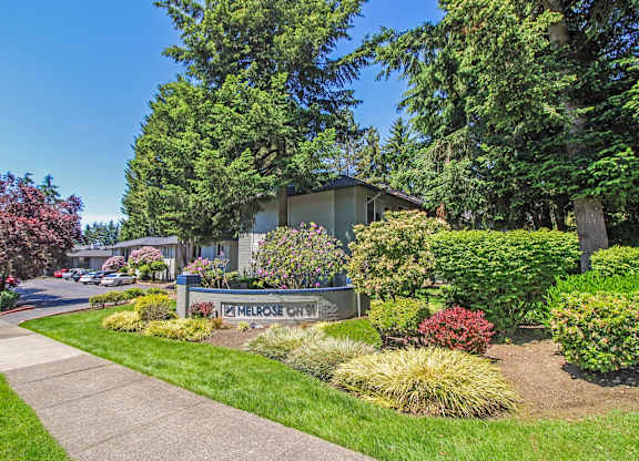 A residential area with a house and a sign that says