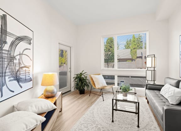 a living room with a couch and a coffee table at The Duo, University Place, 98466