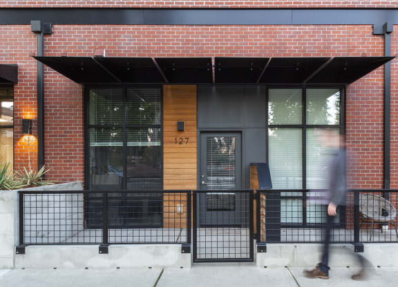 Exterior entrance of a modern apartment with an enclosed covered patio at 6 Wood Flats, Lacey
