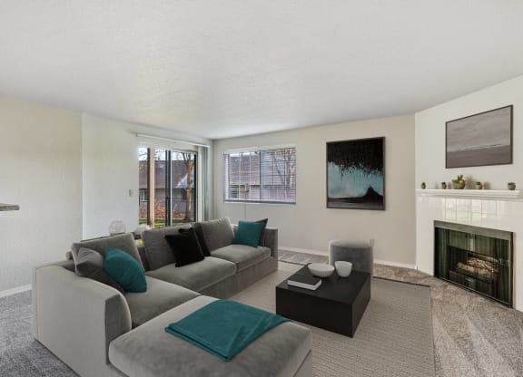 Carpeted living room with gas fireplace and mantle, with sliding glass doors to outside, and window with blinds.at Capitol Crossing, Olympia
