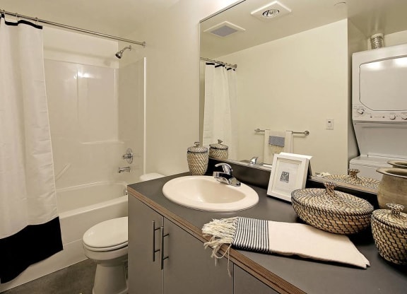 Bathroom with vanity and sink, toilet, and bath/shower combination.at 19th & Mercer, Seattle Washington