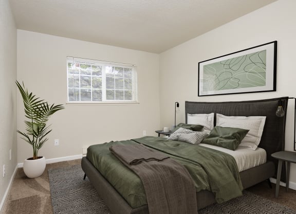 Bedroom with queen size bed, two side tables, and window at University Glen, University Place, 98466