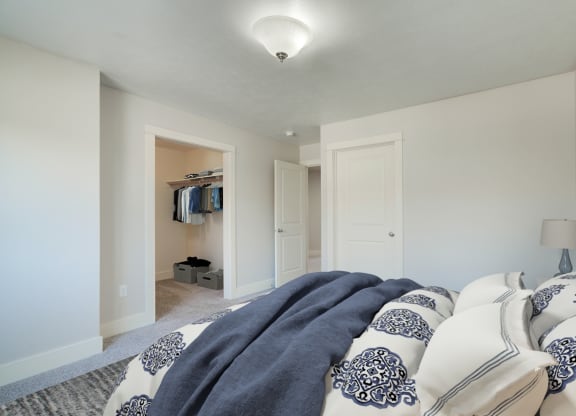 a bedroom with a bed and a closet at Copper Pines, Bozeman, MT