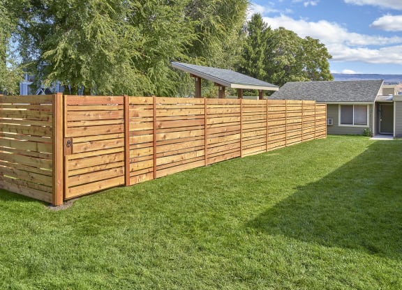 Well maintained, grassy dog run area.at Park View Apartments, Wenatchee, WA