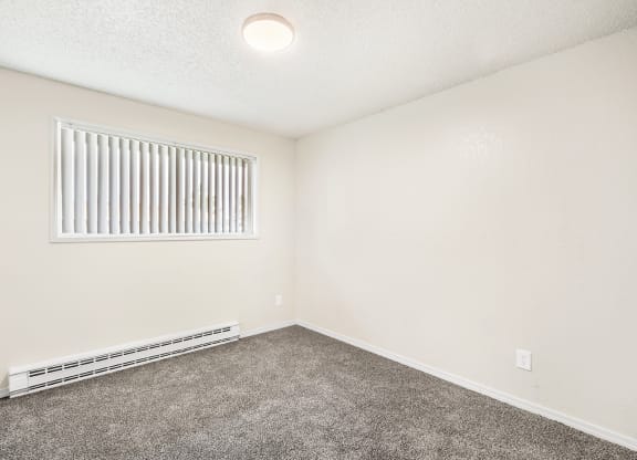 a bedroom with a window and carpet at Wildflower, Kennewick, 99336