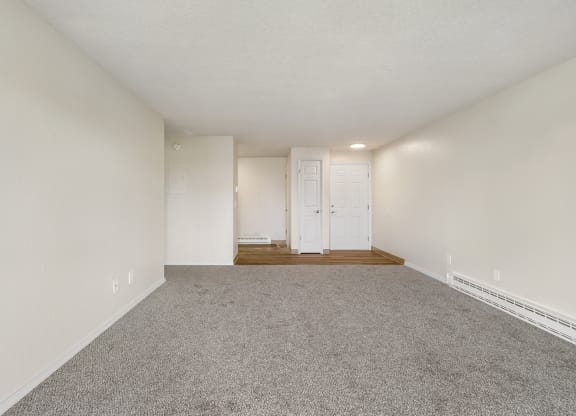 a spacious living room with white walls and carpet at Wildflower, Washington, 99336