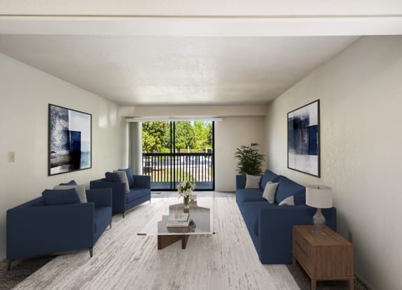 a living room with blue couches and a coffee table at Cedarwood, Wenatchee, WA 98801