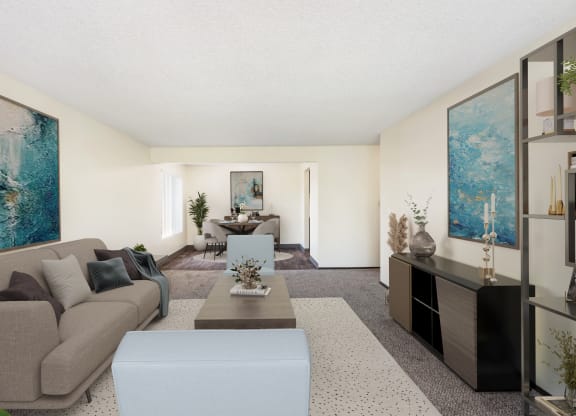 a living room with a couch coffee table and a dining room table in the background at Castlerock, Wenatchee Washington