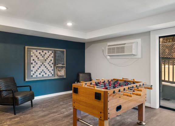 a game room with a foosball table and air conditioner at Castlerock, Washington, 98801