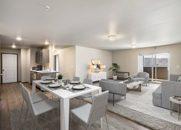 a living room and dining room with a white table and chairs  at Altitude, East Wenatchee, WA, 98802