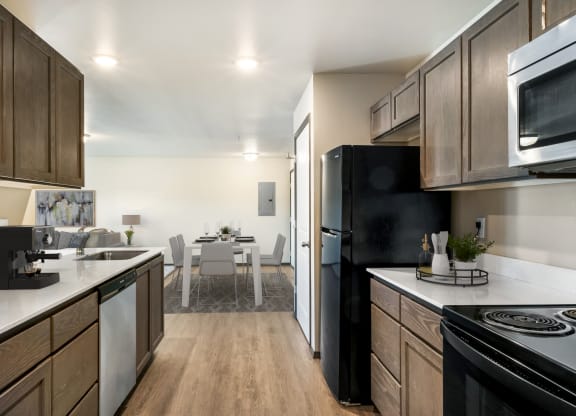 a kitchen and dining area in a 555 waverly unit  at Altitude, East Wenatchee, Washington