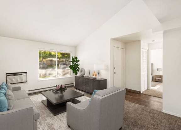 a living room with two couches and a coffee table at Park View Apartments, Wenatchee, 98801