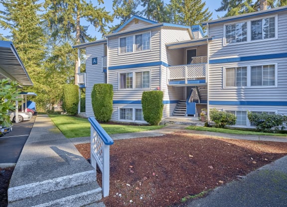 a blue and white house with a sidewalk in front of it  at Edmonds Gateway, Washington