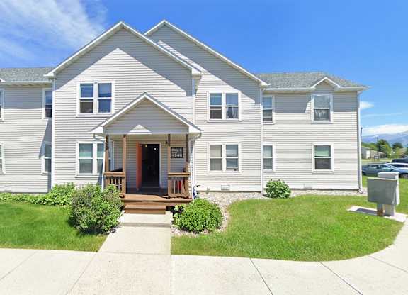 A two-story house with a front porch.